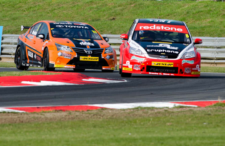 Captivating Thrill Of Speed: High Stakes Car Racing Wallpaper