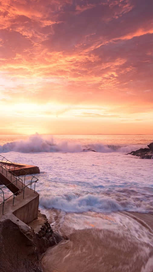 Capture The Perfect Sunset Moment With This Beautiful Beach Scene Wallpaper