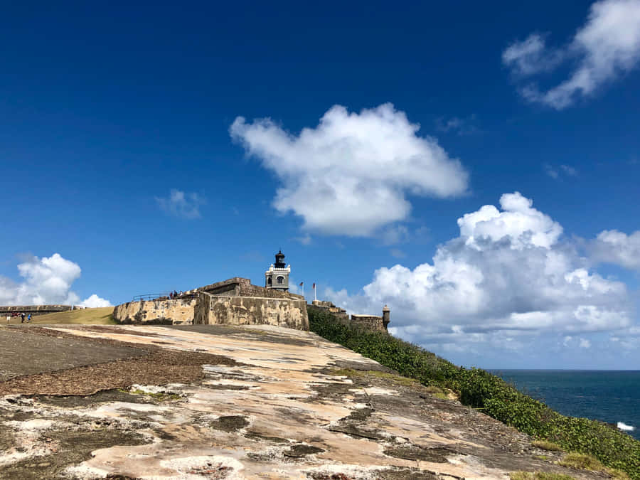 Castillo San Felipe Del Morro Lighthouse From Afar Wallpaper