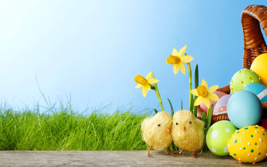 Celebrate Easter With Joyous Decorations Of Easter Eggs, Chicks, And Flowers Wallpaper