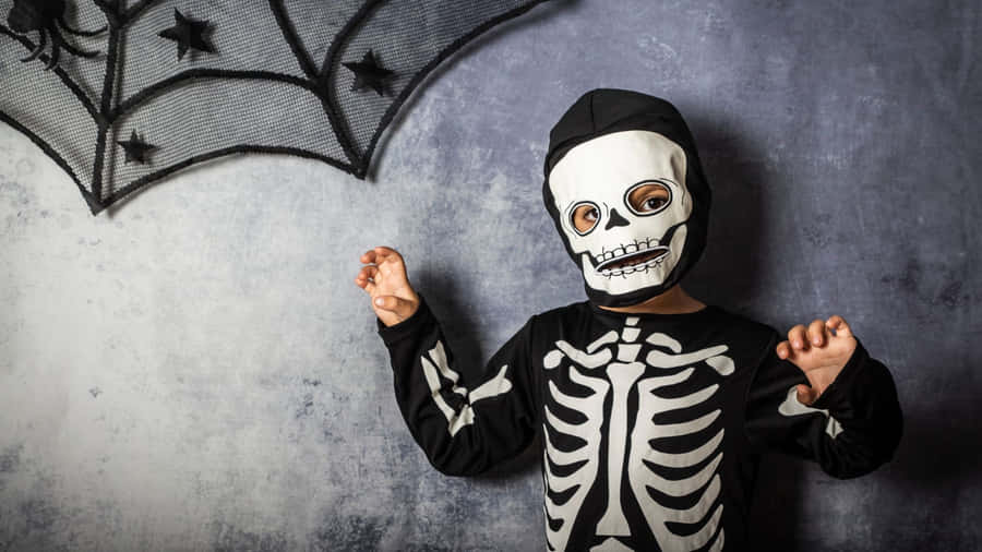 Celebrate Halloween In Style With A Spooky Skeleton Costume! Wallpaper