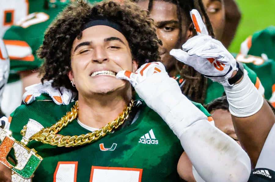 Celebratory Football Playerwith Turnover Chain Wallpaper