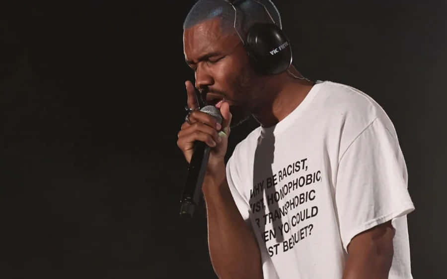 Celebrity Rapper Frank Ocean Working On His Laptop Wallpaper