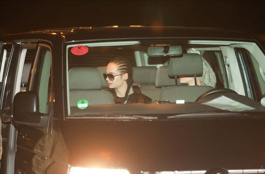 Celebrity Sightingin Vehicleat Night Wallpaper