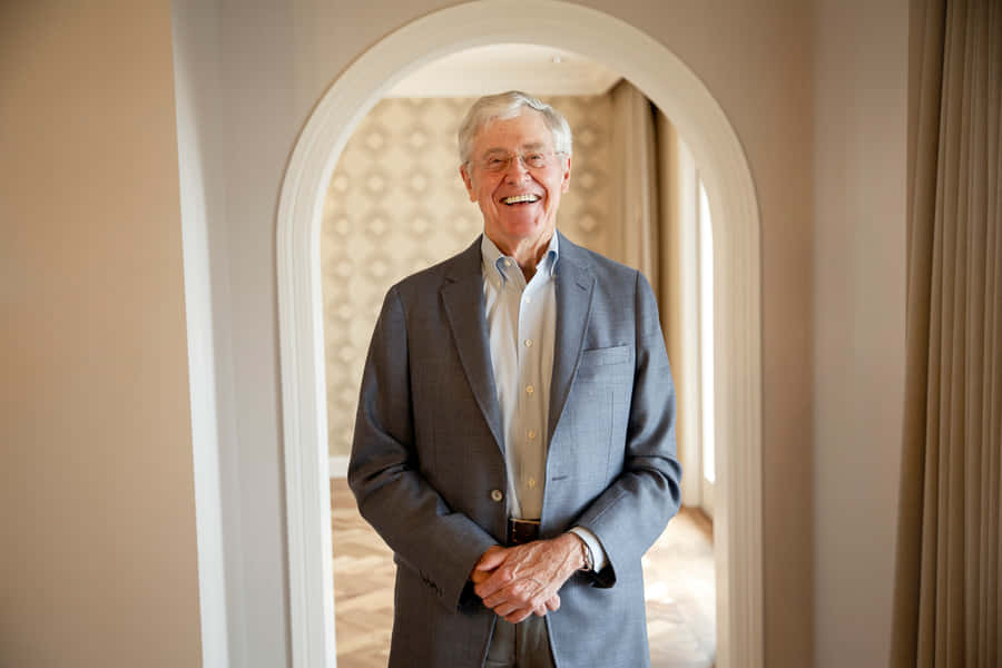 Charles G. Koch Reflecting In Mirror Wallpaper