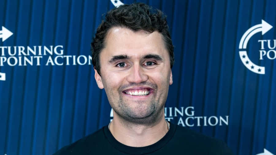 Charlie Kirk At Turning Point Action Wallpaper