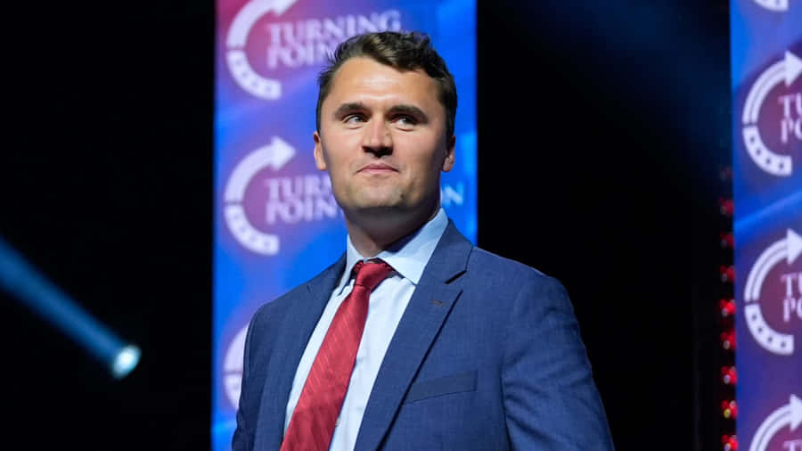 Charlie Kirk Speaking At Turning Point Wallpaper