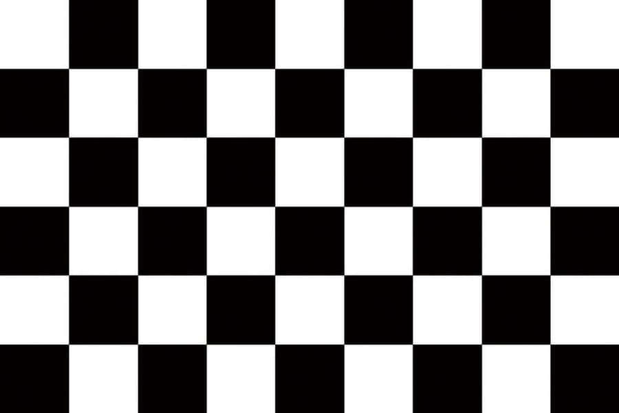 Chequered Flag Waving At A Motorsports Finish Line Wallpaper