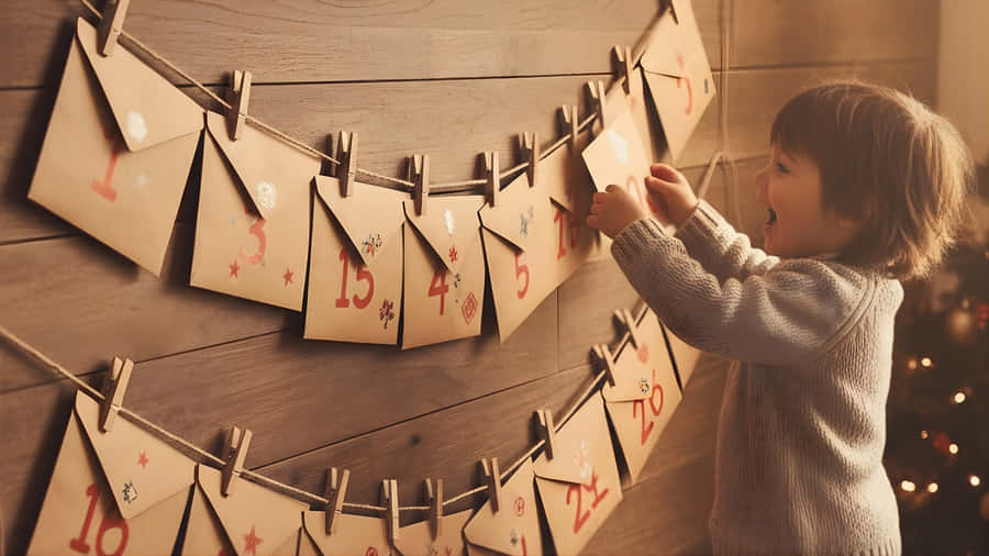 Child Hanging Advent Calendar Envelopes Wallpaper