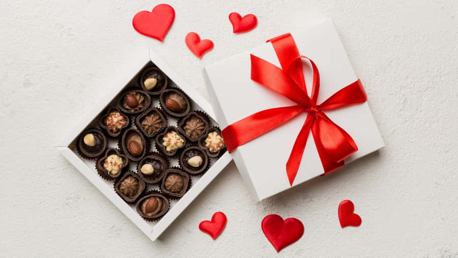 Chocolate Box With Red Ribbon Wallpaper