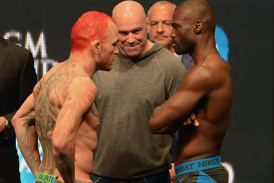 Chris Leben Facing With Uriah Hall Wallpaper