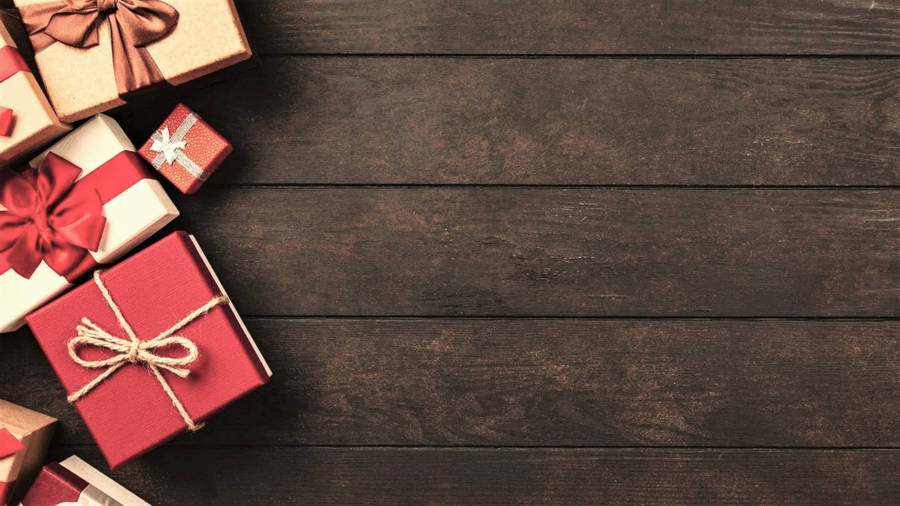 Christmas Aesthetic Gifts On Wood Wallpaper