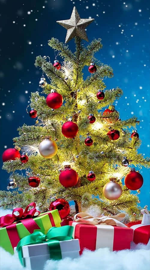 Christmas Treewith Giftsand Snowfall.jpg Wallpaper