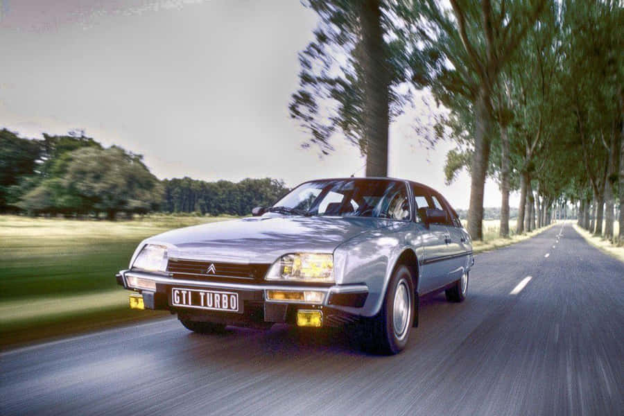Citroen G T I Turbo Speedingon Country Road Wallpaper