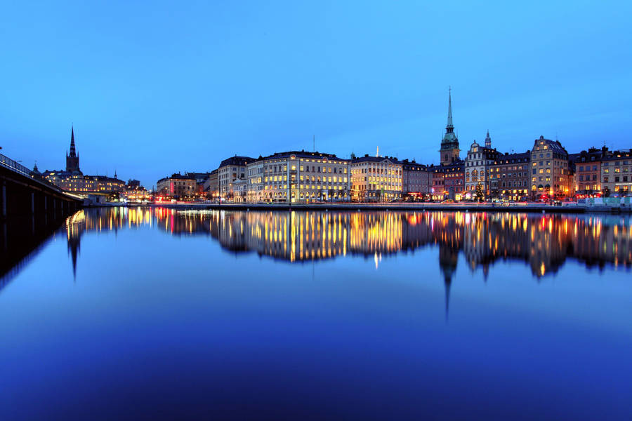 City Of Stockholm Reflecting Water Wallpaper