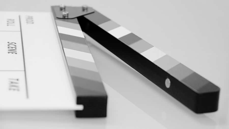 Classic Black And White Film Scene, Showcasing Iconic Screen Stars In An Intense And Emotional Moment Wallpaper