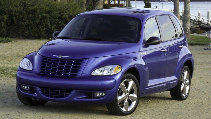 Classic Chrysler Pt Cruiser On Scenic Road Wallpaper