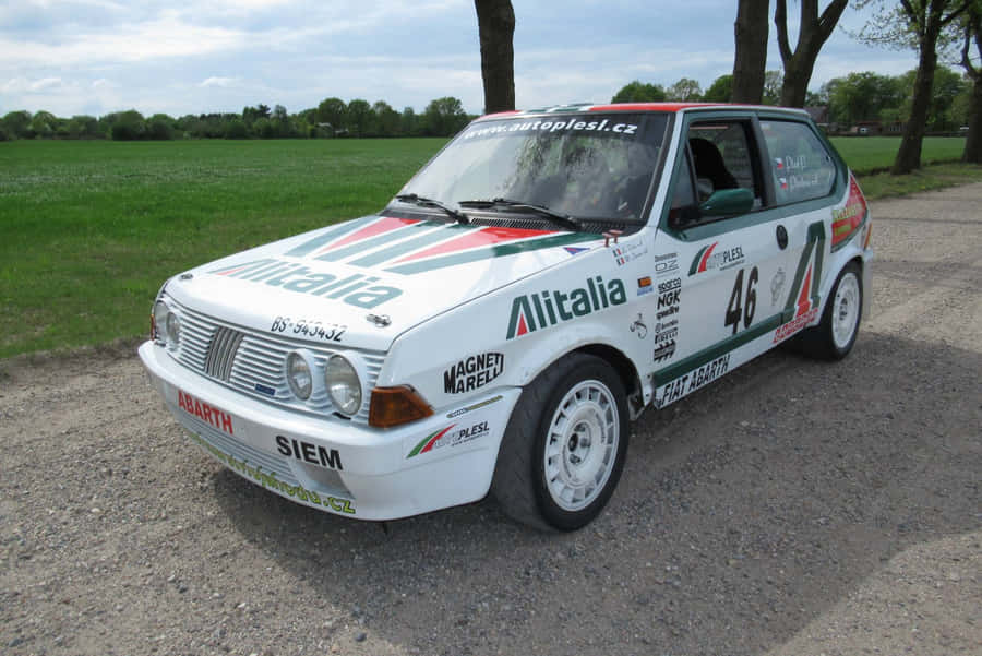 Classic Fiat Ritmo On A Scenic Road Wallpaper