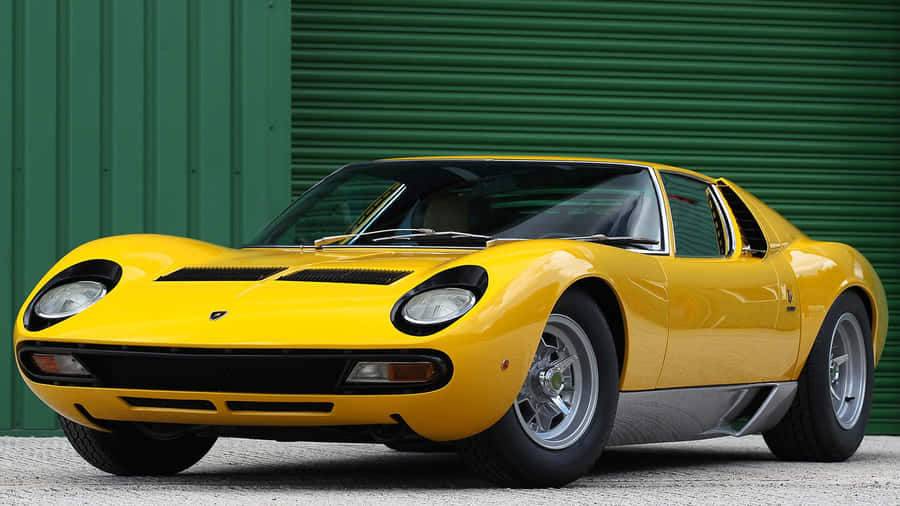 Classic Lamborghini Miura In Vibrant Yellow Wallpaper