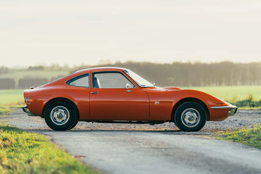 Classic Opel Gt Sports Car In Full Speed Wallpaper