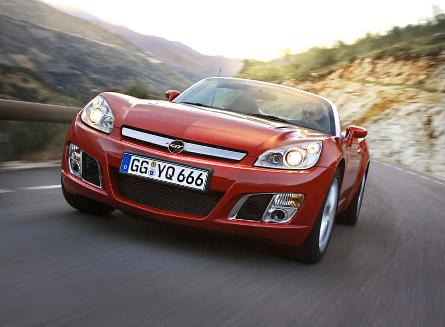 Classic Opel Gt Sports Car On The Road Wallpaper