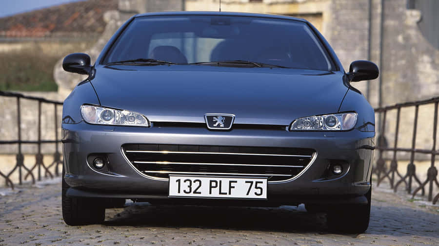 Classic Peugeot 406 Sedan In Bright Sunlight Wallpaper