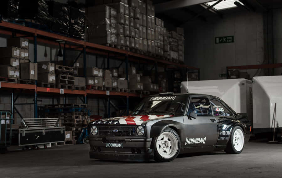 Classic Red Ford Escort On A Scenic Road Wallpaper