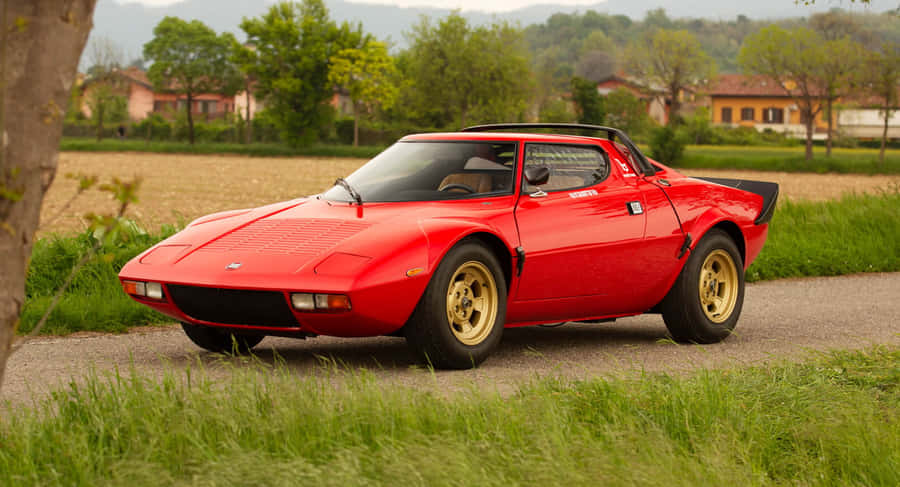 Classic Red Lancia Stratos Side View Wallpaper