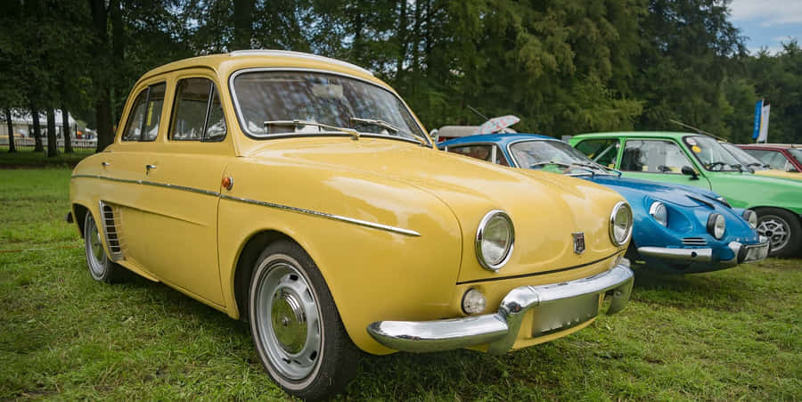 Classic Renault Dauphine Against A Dusk Sky Wallpaper