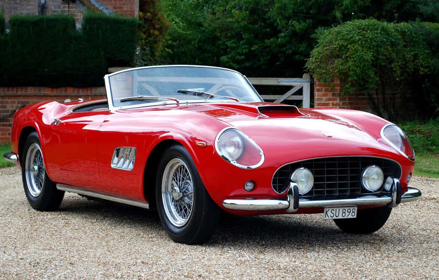 Classic Vintage Car On A Tranquil Road Wallpaper