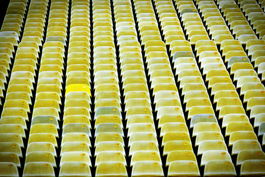 Clean And Conspicuous Yellow Chair Wallpaper