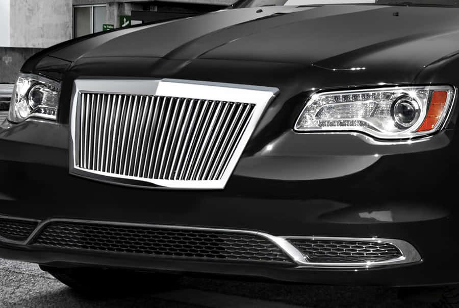 Close-up Of A Glossy Car Grill On A Luxury Automobile Wallpaper