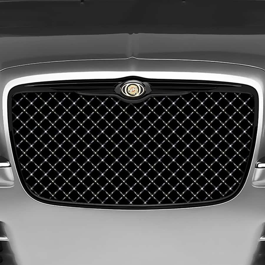 Close-up Of A Sleek Car Grill Wallpaper