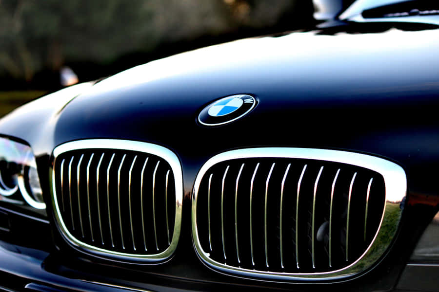 Close-up Of Sleek Car Grill Design Wallpaper