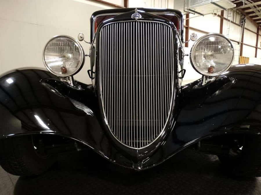 Close-up View Of A Car Grill On A Sleek, Modern Vehicle Wallpaper
