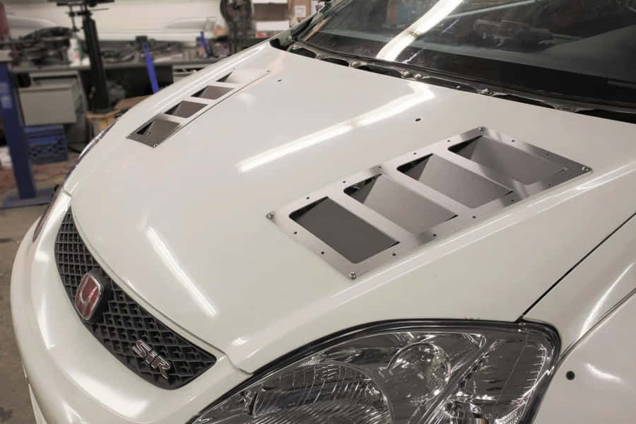 Close-up View Of A Sleek Car Hood Wallpaper