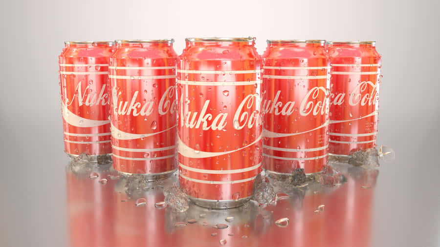 Coca Cola Cans On A Silver Surface Wallpaper