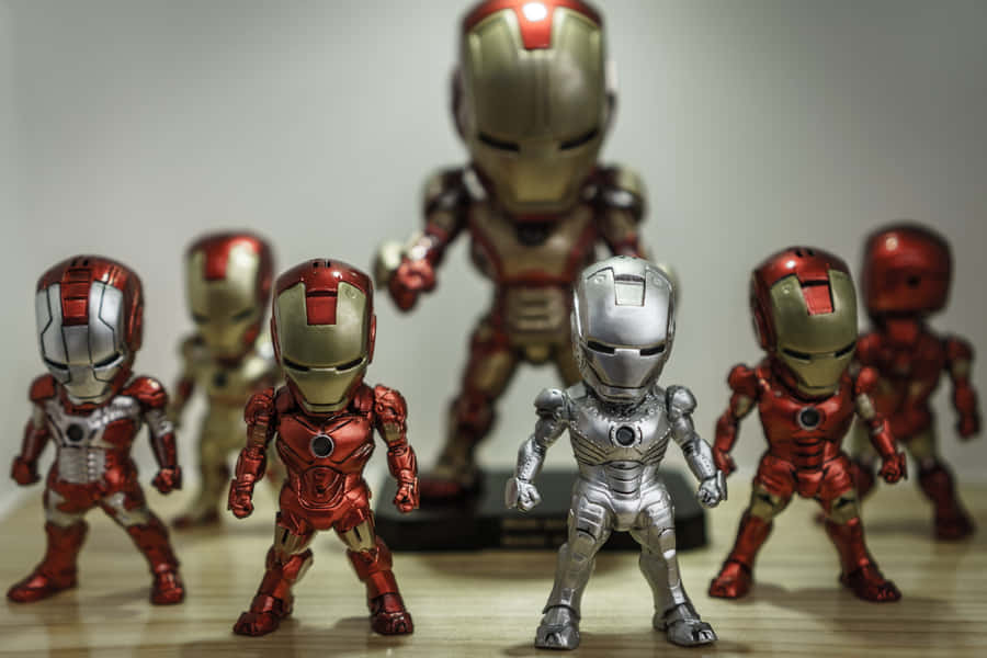 Collect And Display Your Favorite Iron Man Action Figures Wallpaper