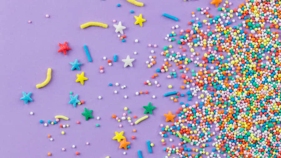 Colorful Sprinkleson Purple Background Wallpaper