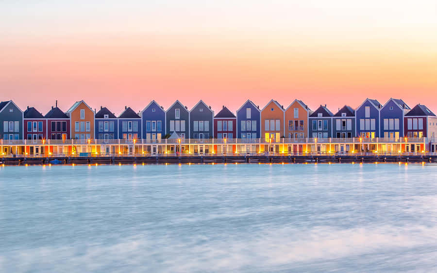 Colorful Waterfront Housesat Sunset Wallpaper