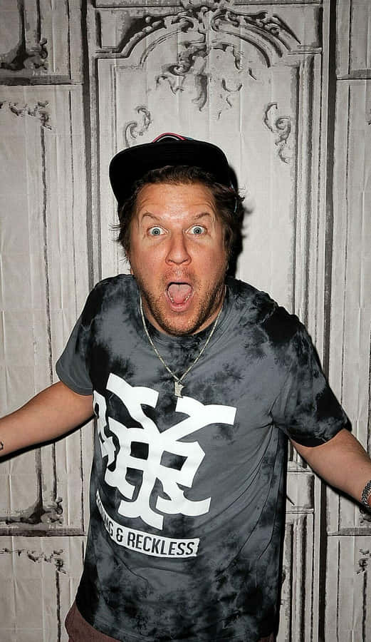 Comedian Nick Swardson Performing On Stage Wallpaper