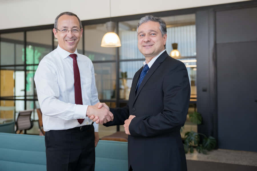 Complete Your Outfit With A Stylish Navy Blue Tie. Wallpaper