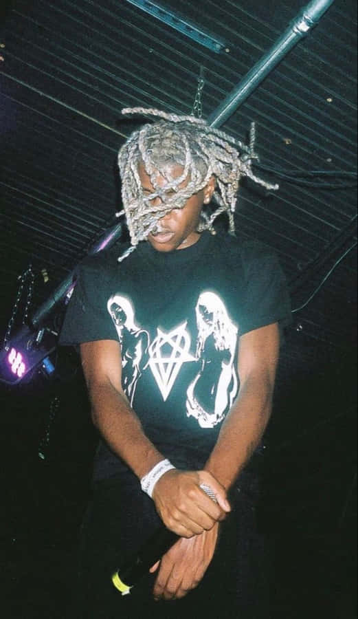 Concert Scenewith Dreadlocked Individual Wallpaper