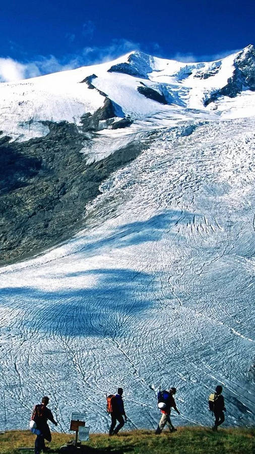 Conquering Snowy Peaks Wallpaper