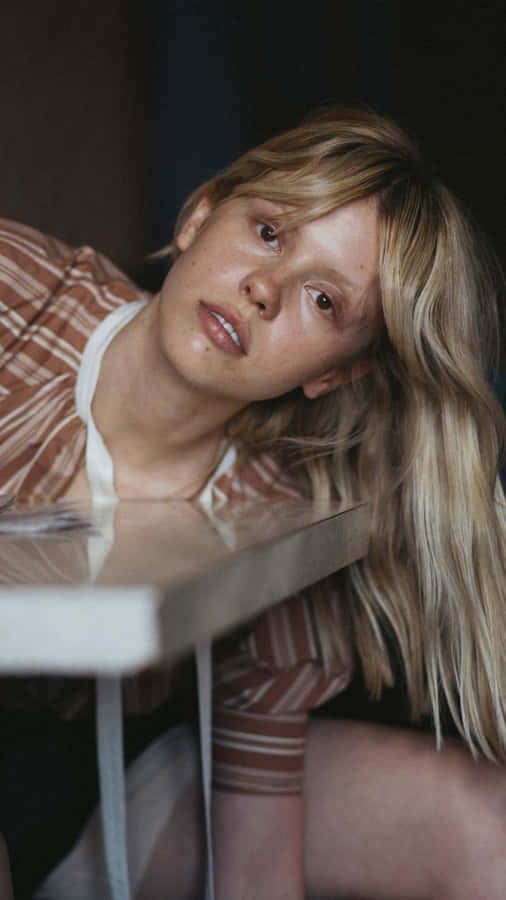 Contemplative Blonde Woman Portrait Wallpaper