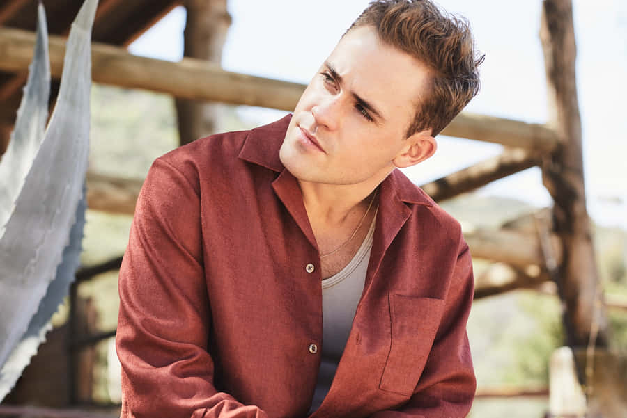 Contemplative Man Outdoors Wallpaper