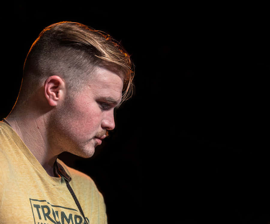 Contemplative Musician Profile Wallpaper