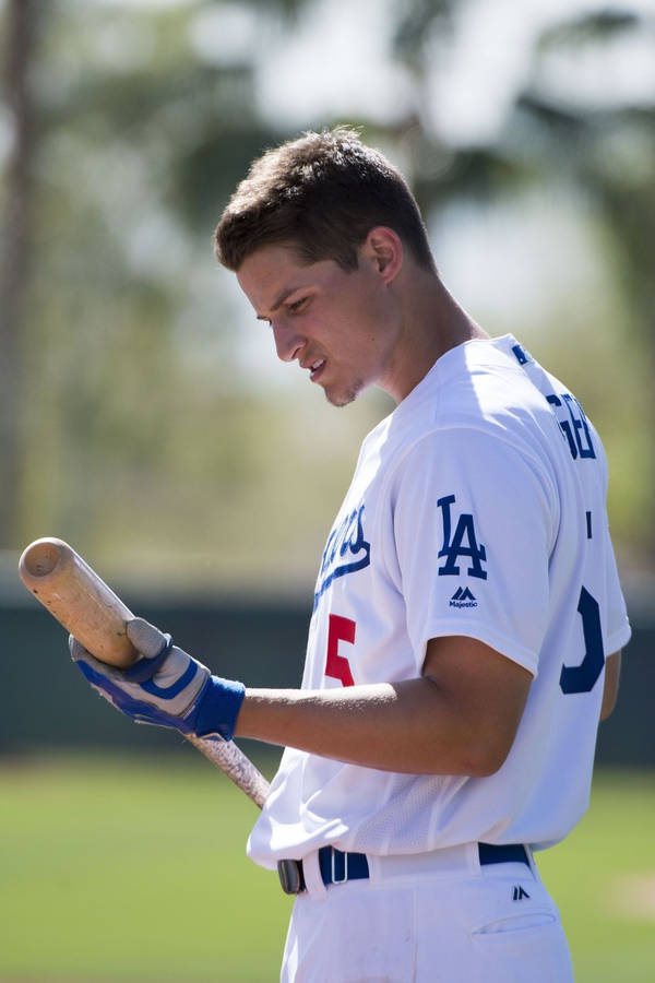 Corey Seager Looking Down On Baseball Bat Wallpaper