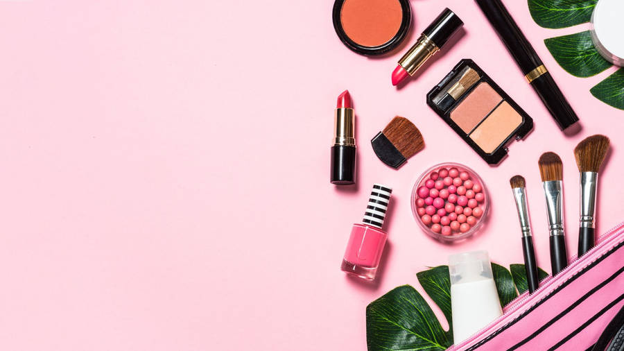 Cosmetics On Baby Pink Surface Wallpaper