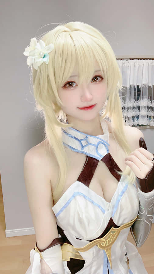 Cosplayer Posing As An Anime Kawaii Character In An Indoor Photoshoot Wallpaper